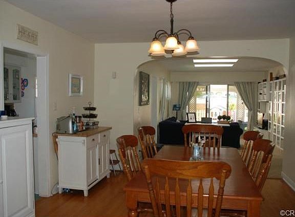 Lovely dining room with family room beyond