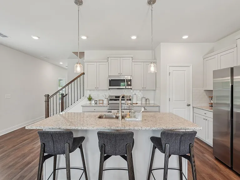 Sophisticated living space showcasing an open flow between the living and dining areas.