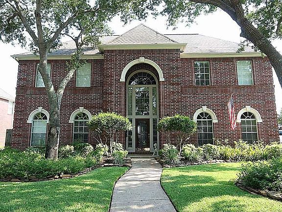 This stately Newmark has cast stone accents around the arched windows and is on one of the best wate