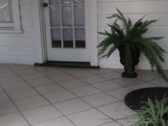 Inside porch with French door leading to front bedroom front door on the right