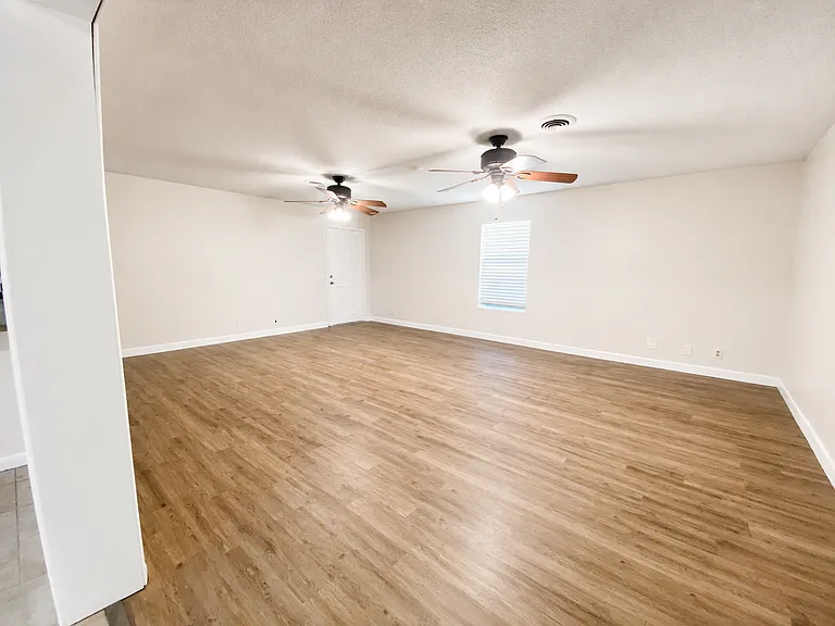 Large living room with vinyl plank flooring