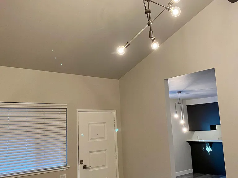 View from living room to dining area and kitchen.