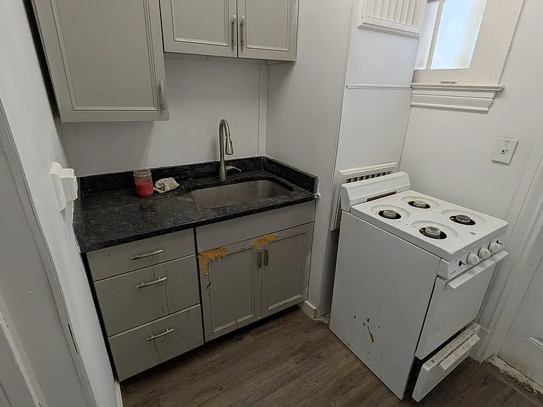 Kitchen (cabinets will be repaired prior to move in)