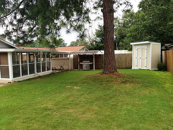 Backyard with covered porch and grill area
