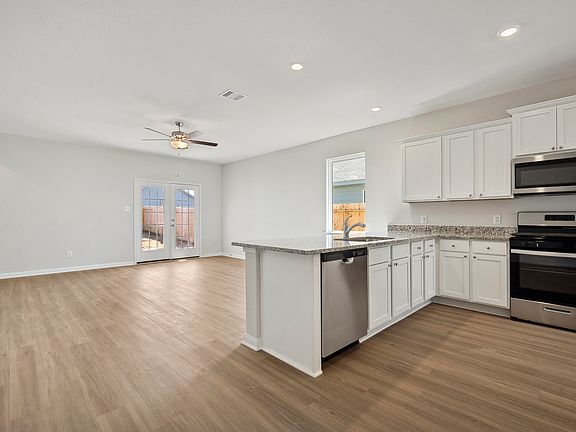 The kitchen comes with granite countertops and stainless steel appliances!