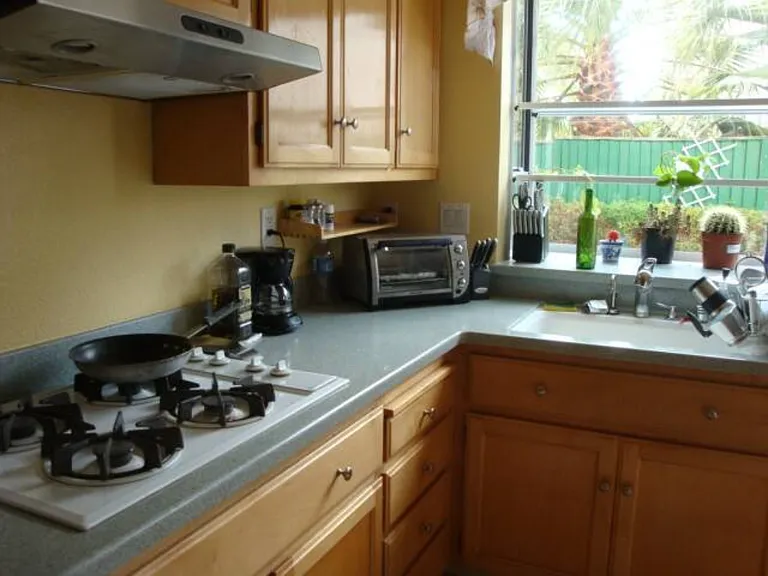 Kitchen opens to backyard