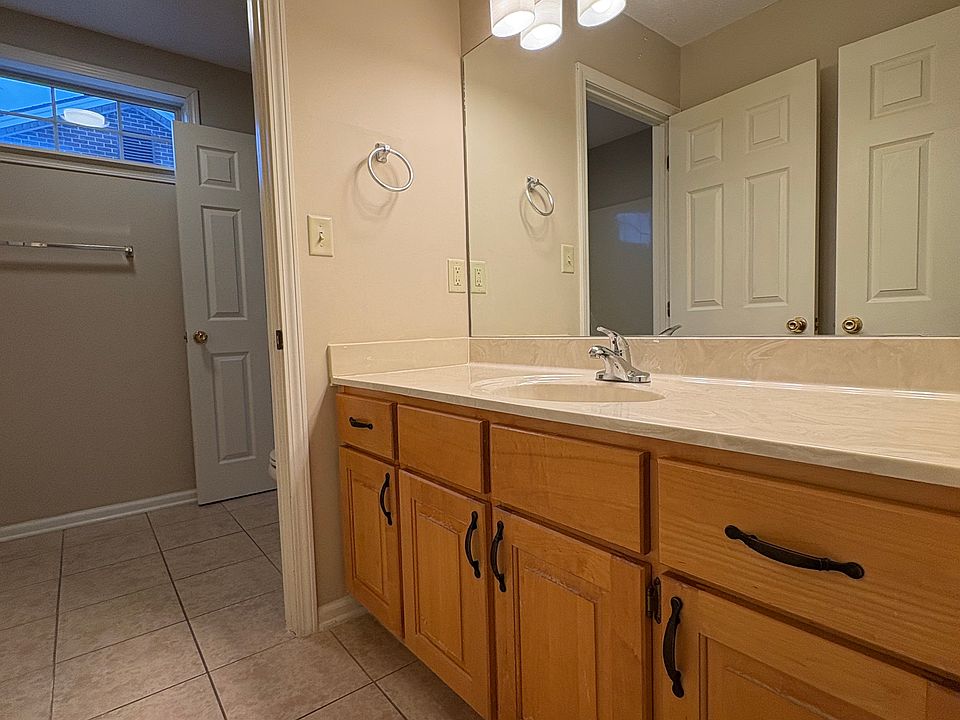 upstairs full bathroom vanity upstairs with porcelain tile