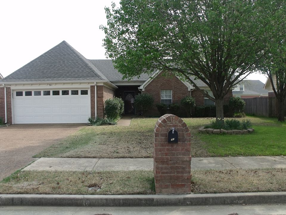 Shaded Front Yard with 2-Car garage