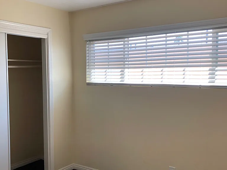 Third Bedroom, new carpet. large closet, lighted ceiling fan and large window.