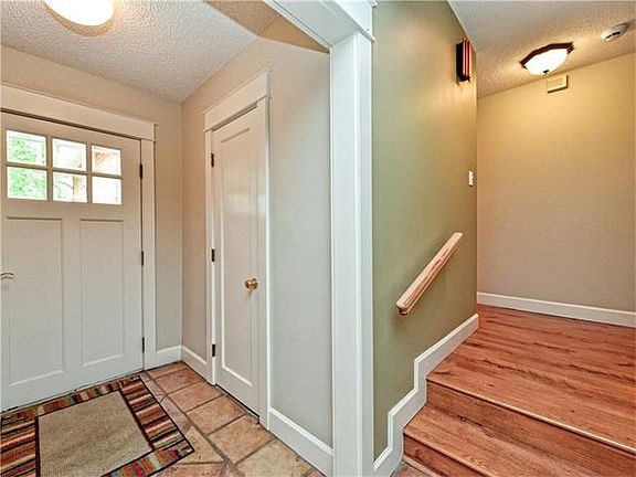 A discerning entry draws you inside. Custom wood moldings and updated light fixtures are some of the