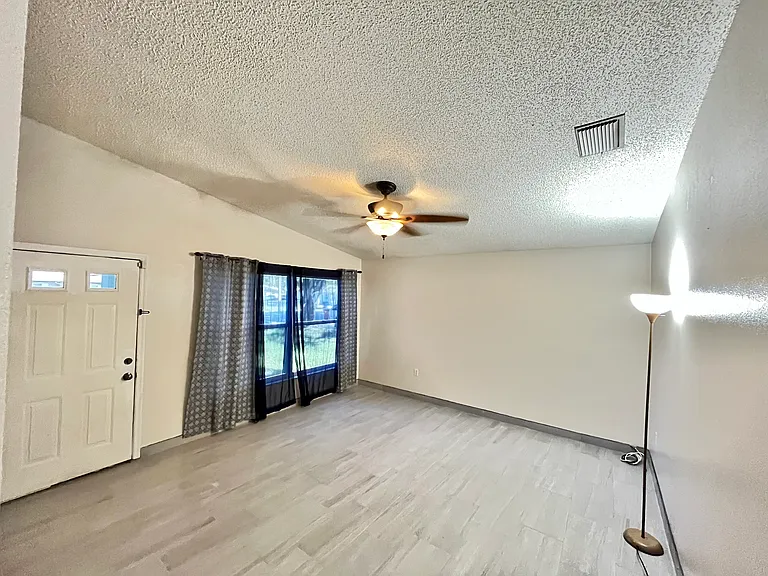 Vaulted ceiling throughout the house including living room