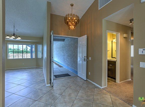 Attractive double-door entry with vintage lighting