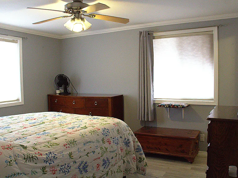 Primary bedroom (furniture and curtains not included); Top down bottom up custom shades included)