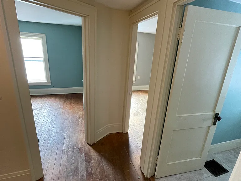 Upstairs doorways into 2 bedrooms and bathroom.