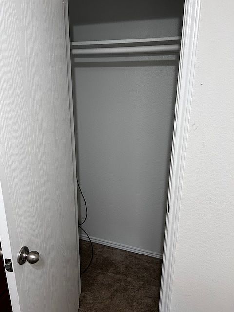 Small closet with space above and below for storage