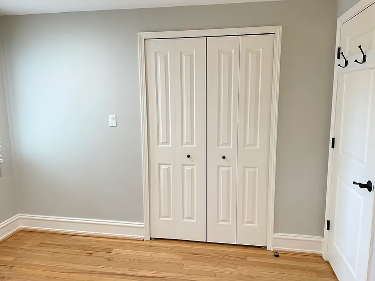 Second bedroom entrance with hooks and closet