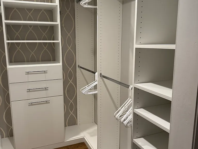 Primary bedroom walk-in closet.