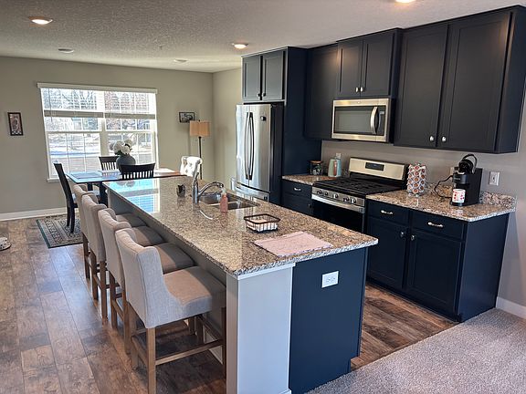 HUGE center island for entertaining, and all appliances are 1-year-old