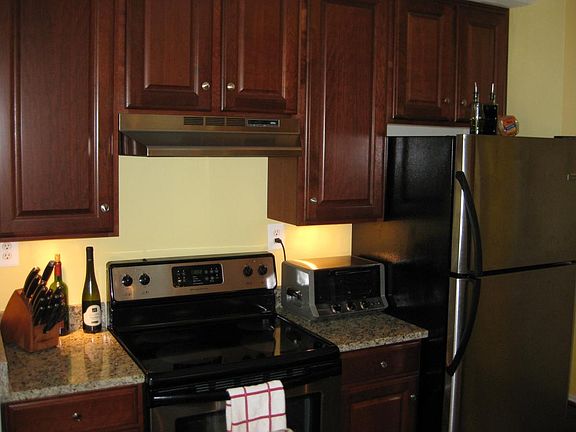 Kitchen with upgraded granite and stainless steel