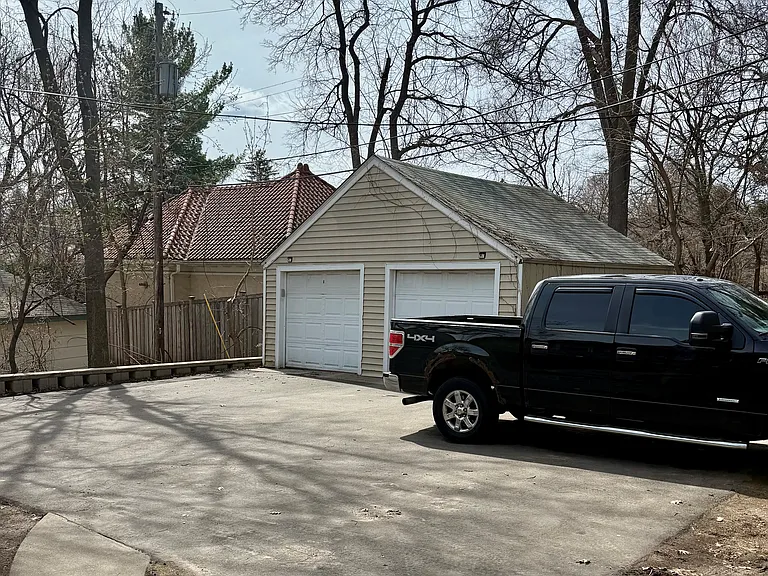 Single garage stall for each unit with a large parking pad.