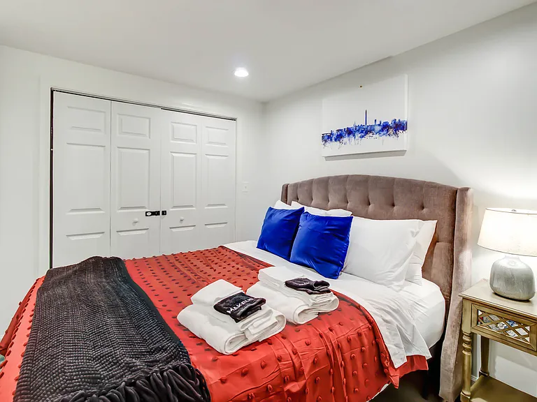 This spacious bedroom offers a comfortable layout and features a large closet for ample storage.