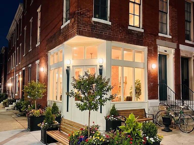 Outdoor of this historic corner property that has many options to make cozy due to the large curb that acts as an easy outdoor space to decorate and relax