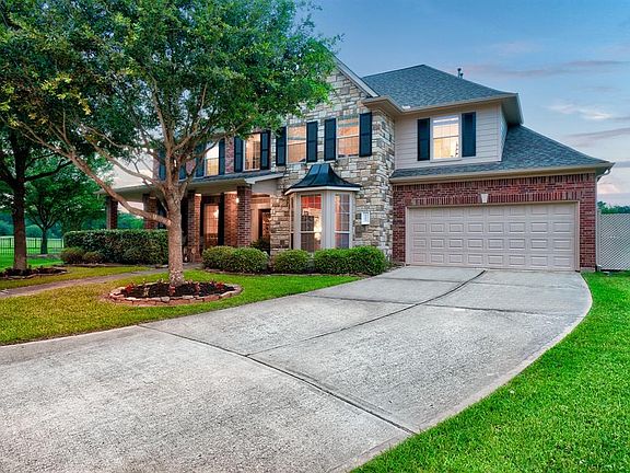 The three car tandem garage and large driveway is perfect for extra parking.