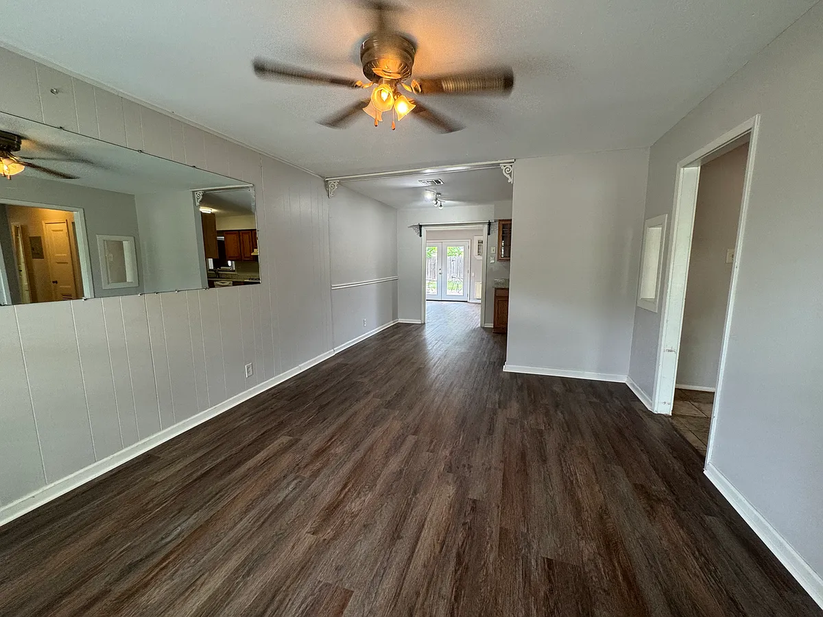 New flooring throughout main areas. Open floor plan with front and back living areas. Back living area has double doors opening to backyard (pictured). - 275 Greenhill Pass