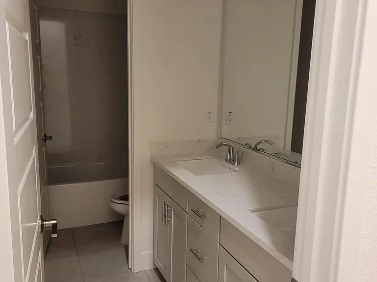 SHARED BATH ROOM W/ FULL BATH WITH 2 SINKS, SHOWER/TUB COMBO