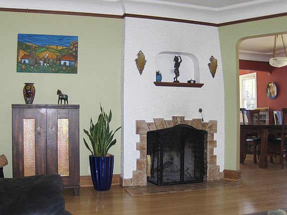 Period Fireplace with Original Sconces Coved Ceilings in Living Formal Dining