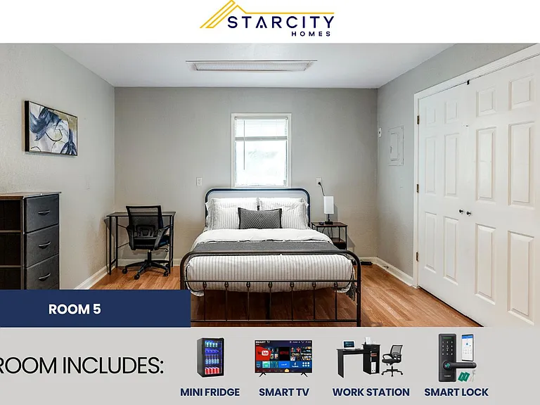 Furnished bedroom with a full bed, bedside table, and dedicated desk area, plus a roomy double-door closet.