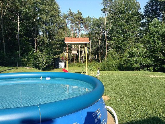 Deep back yard surrounded by