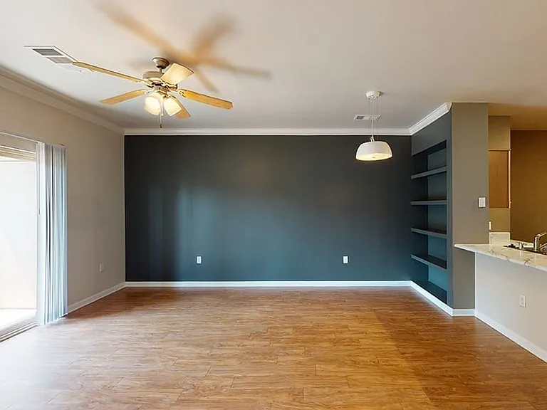 Apartment living room with wood-style flooring.