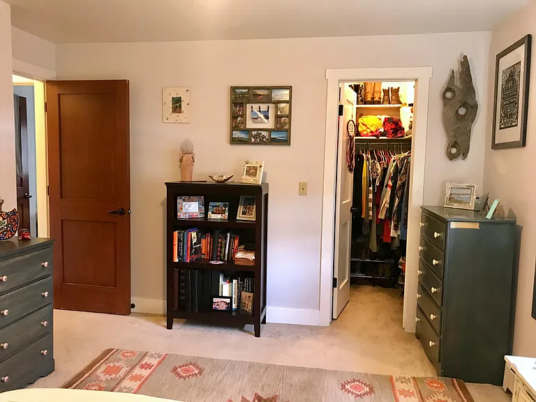 Large/master bedroom with view of walk-in closet