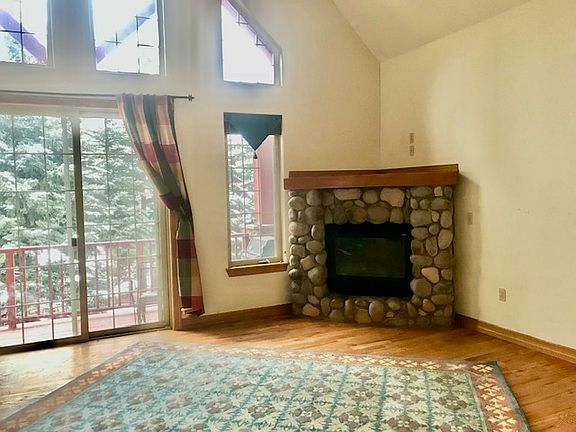 Living room with cathedral ceiling and gas fireplace