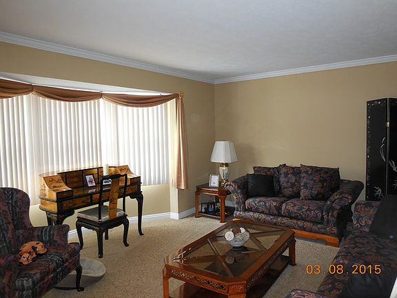 Living Room with bay window 14'X15
						:
						Crown mold and 5" baseboards. Furniture for sale: price to be negotiated.