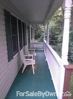 FRONT PORCH
						:
						COVERED, STEPS LEAD UP FROM DRIVEWAY, OR ACCESS FROM SIDE DECK