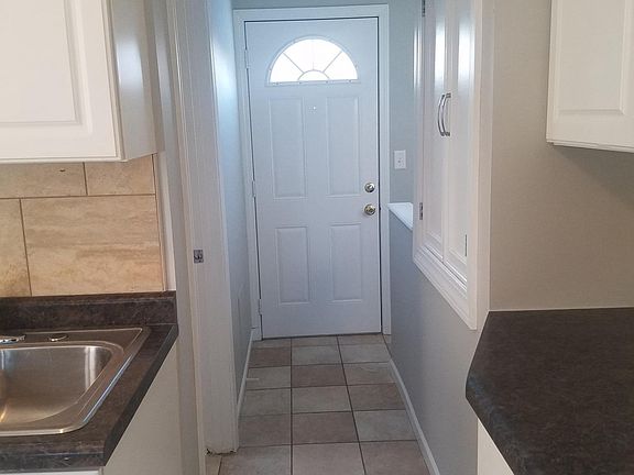 Tile in kitchen dinning room bathroom and hallway