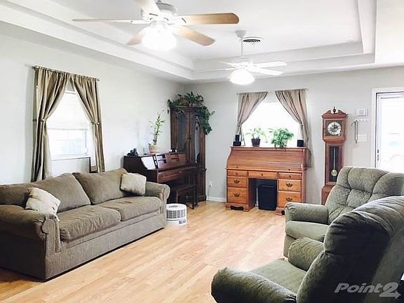 Living area with nice laminate wood flooring