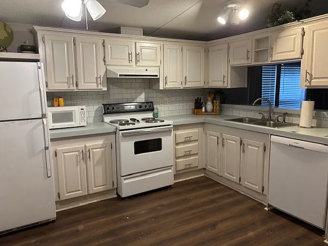 Kitchen including Stove, microwave, dishwasher and fridge. New Ceiling fan and lighting. Room for a small table and chairs. NOTE: Stove has been updated to glass top