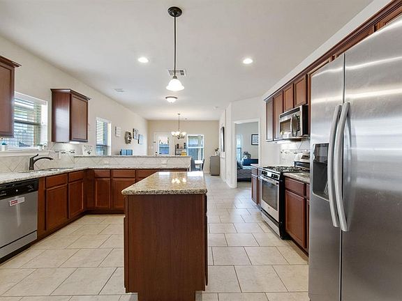 Beautiful kitchen with island, breakfast bar, stainless appliances and granite counters!