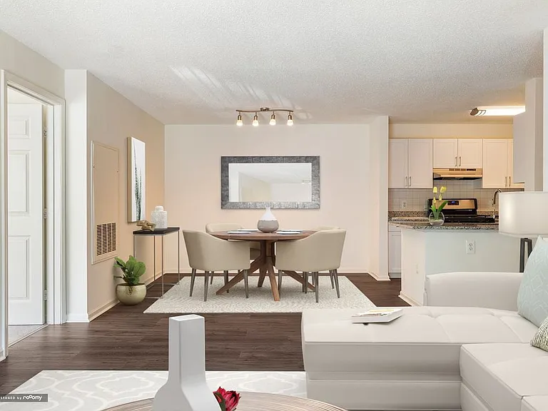 Renovated Package I living and dining areas with hard surface plank flooring throughout