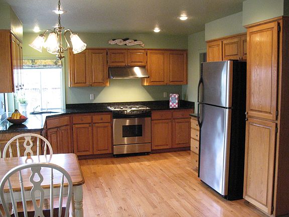 Tastefully updated kitchen with Granite Counters, SS appliances & gas range.