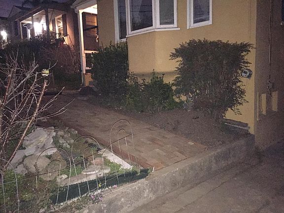 Brick Path between driveway and walkway.