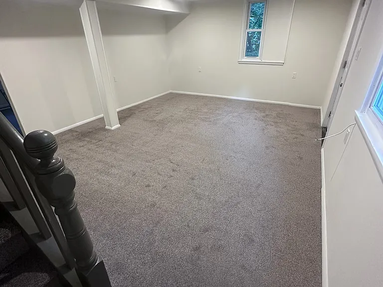 Newly carpeted large Living Room.