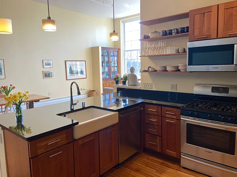 Kitchen is open concept to dining room and living room.