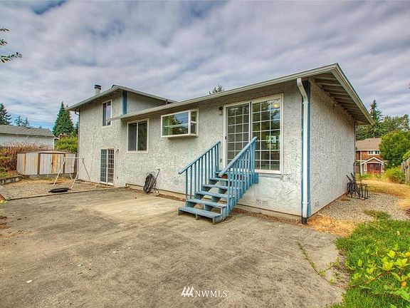 Back patio, stairs lead to dining room.