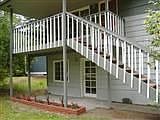 Lower patio in the front of the house, Door leads to Large family room.