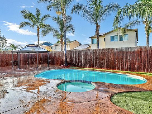 LOOK AT THIS SWIMMING POOL AND SPA! Gorgeous! It feels like paradise in your own backyard.
