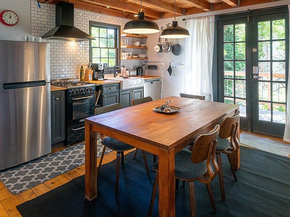 Full kitchen with gas stove, refrigerator, dishwasher, microwave, coffee maker, and toaster